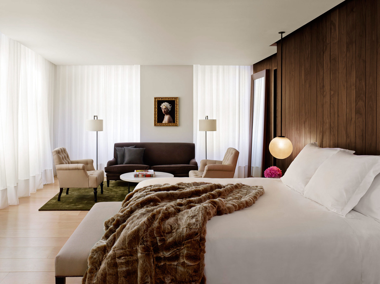 Multiple windows, a high ceiling and large seating area create a cozy, welcoming ambiance in our Loft suites.